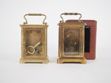 pair of antique brass alarm clocks with key and case
