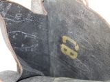 a close up of a pair of shoes with a shoe tag on it