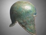 a bronze helmet on a gray background with a gray background
