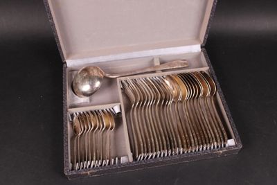 a box with silverware inside of it on a table