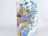 un livre sur lequel figure l'image d'un vase avec des fleurs
