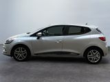 the silver car is parked on the concrete floor in the room