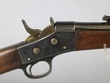 a close up of a rifle on a white background with a white background