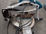 someone is using a circular saw to cut a piece of metal