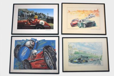 four framed pictures of racing cars on display in a room