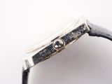 an image of a close up of a watch on a white surface