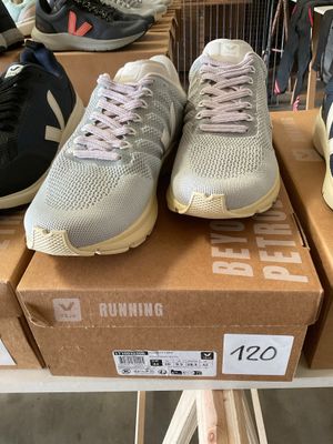several pairs of running shoes are on display in a shoe store