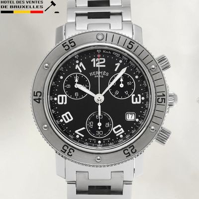 a close up of a watch on a white background