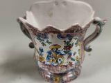 a small cup that is sitting on a table