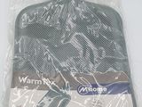 a hot water bottle in a plastic bag on a table