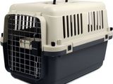 an image of a dog carrier with a door open on a white background