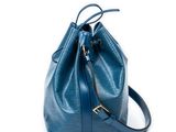 a blue bucket bag on a white background with a strap