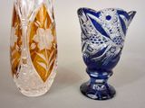 two vases sitting next to each other on a table