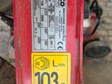 a red fire hydrant that has a sticker on it