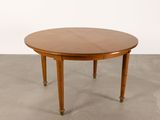 an image of a wooden table with two legs and a round top