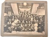 an old photo of a group of people posing for a picture