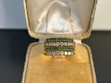 a close up of a ring in a box on a table
