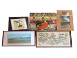 a lot of paintings on display on the wall