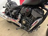 a black motorcycle that is parked in a lot