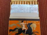 a box of cigarettes with a picture of a woman riding a horse