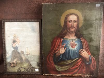 two paintings of jesus and a dog are on a shelf