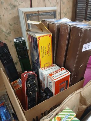 a box full of assorted cell phones and other items