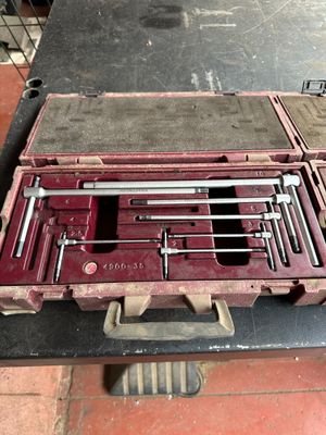 a tool case with tools in it on a table