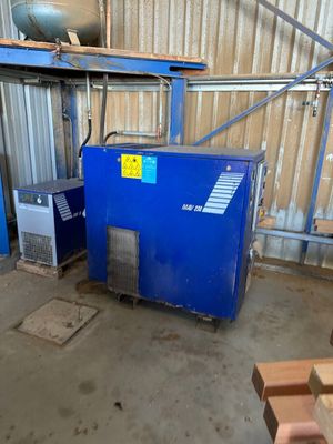 a blue machine that is sitting in a room