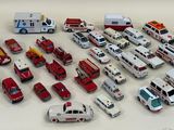 many different types of toy ambulances on the table