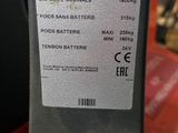 a close up of a toyota remote control unit on a red table