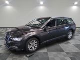the volkswagen passat is parked in a large room with a checkered floor