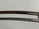 two swords that are on display on a white surface