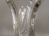 a glass vase that is sitting on a table