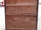 an old wooden dresser sitting in the middle of a room