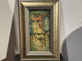 une photo d'une photo représentant une maison, dans un cadre