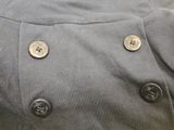 a close up of a jacket with buttons on it