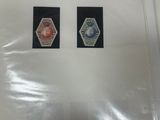 two stickers on the back of a folder of paper
