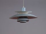 a light that is hanging from the ceiling in the room