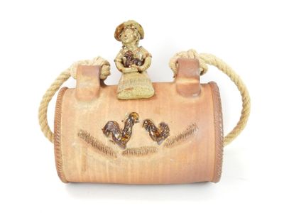 a small wooden bag with a figurine on top of it