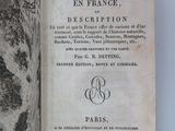 an open book with a black and white drawing on it