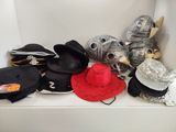 many hats that are sitting on a shelf
