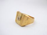 a close up of a gold ring with the number 18 on it