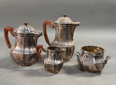 three pieces of silverware are sitting on a gray surface