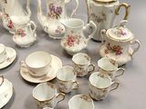 a lot of tea and coffee cups and saucers