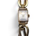 a close up of a wrist watch with a metal clasp