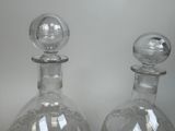 two decanters that are sitting on a table