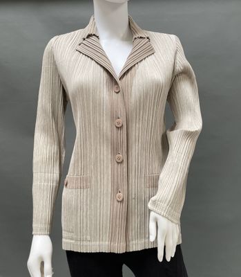 an image of a mannequin wearing a beige jacket and black pants