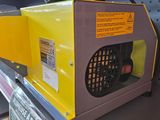 a yellow and gray blow dryer sitting on a shelf in a store