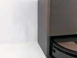 a black and silver vacuum cleaner sitting on top of a table