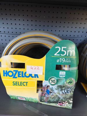 several different types of garden hoses on the shelf